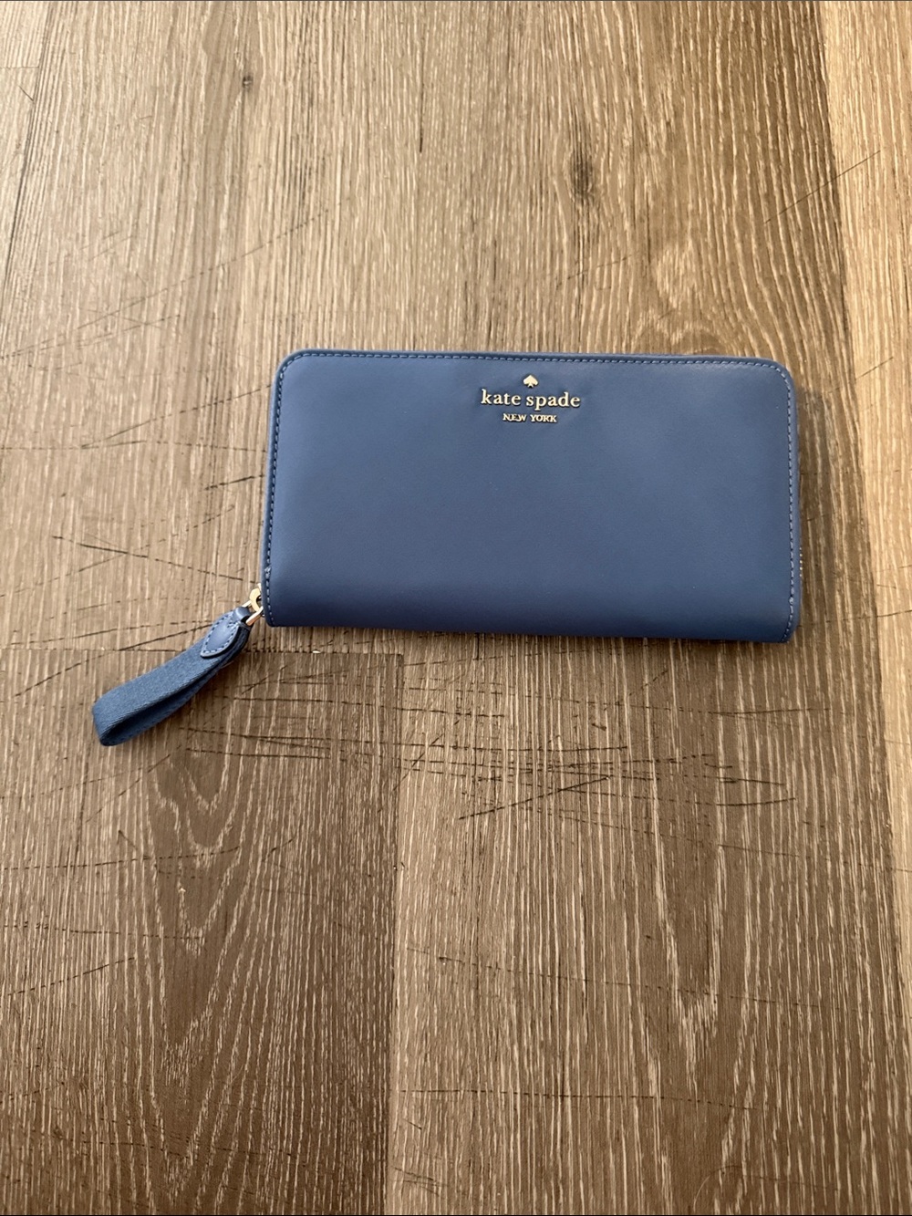 kate spade navy blue zip-around wristlet wallet